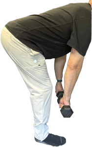 Performing a stiff leg deadlift for the biceps femoris for knee replacement rehab