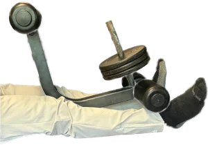 Performing a double leg extension with the toes out for the vastus medialis for knee replacement rehab